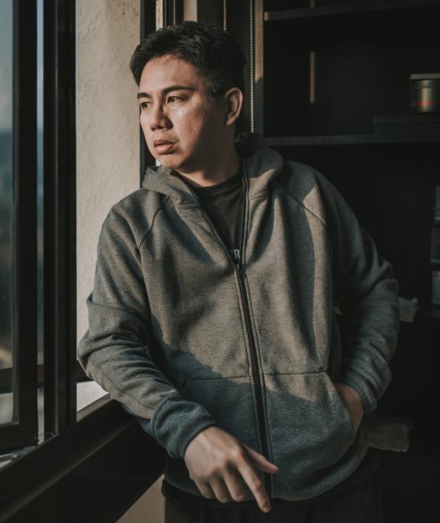 man in window