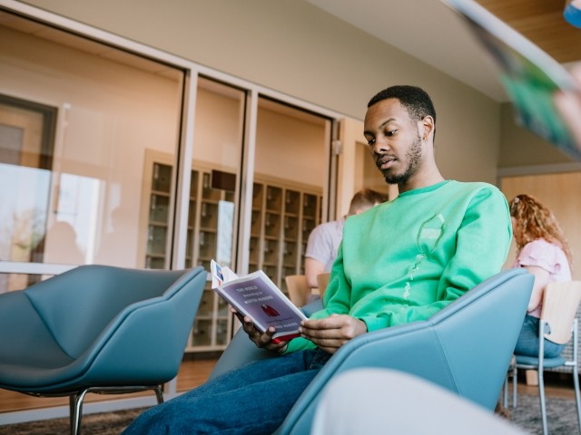 A man reads a book in a treatment center