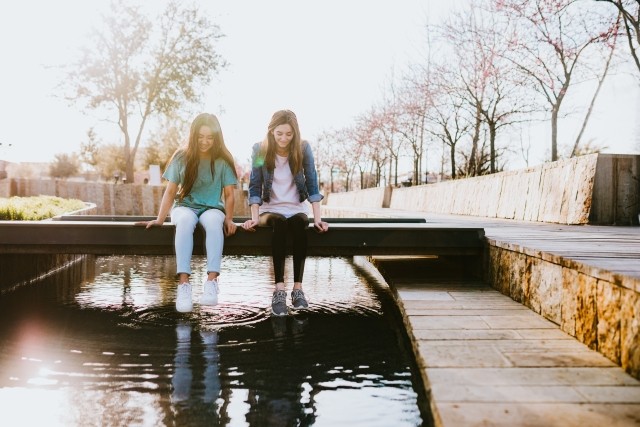 Two friends in eating disorder recovery support each other as they navigate social media.