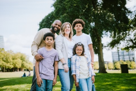 A family standing together outdoors